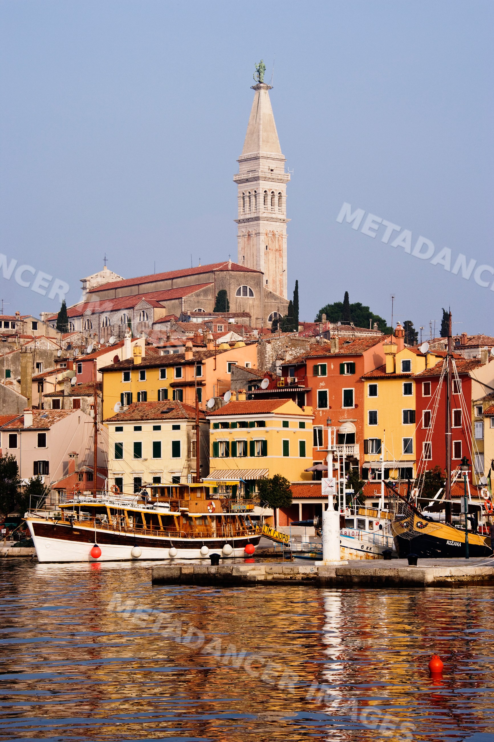 Harbor view with boats and church tower, croatia