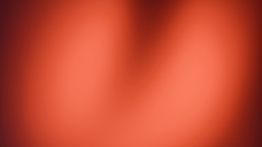 Smooth red and orange gradient background with soft warm texture