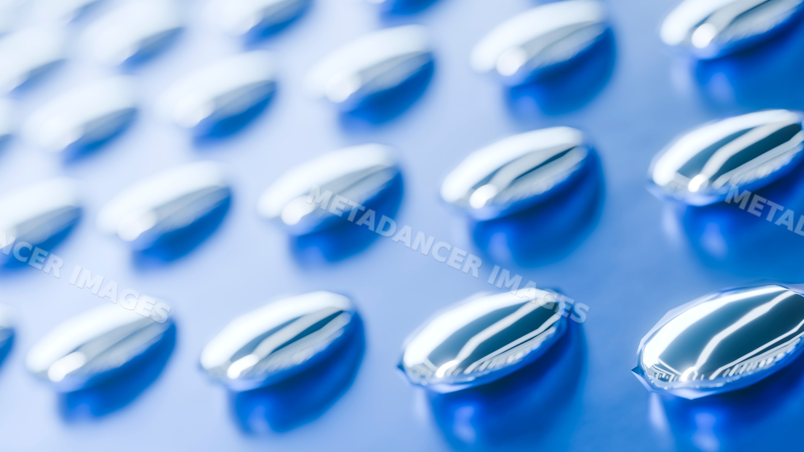 Close-up digital illustration of blue capsule pills in a blister pack