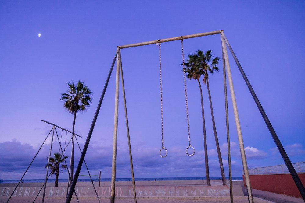 Gymnastic rings outdoor exercise area at Venice Beach at twilight