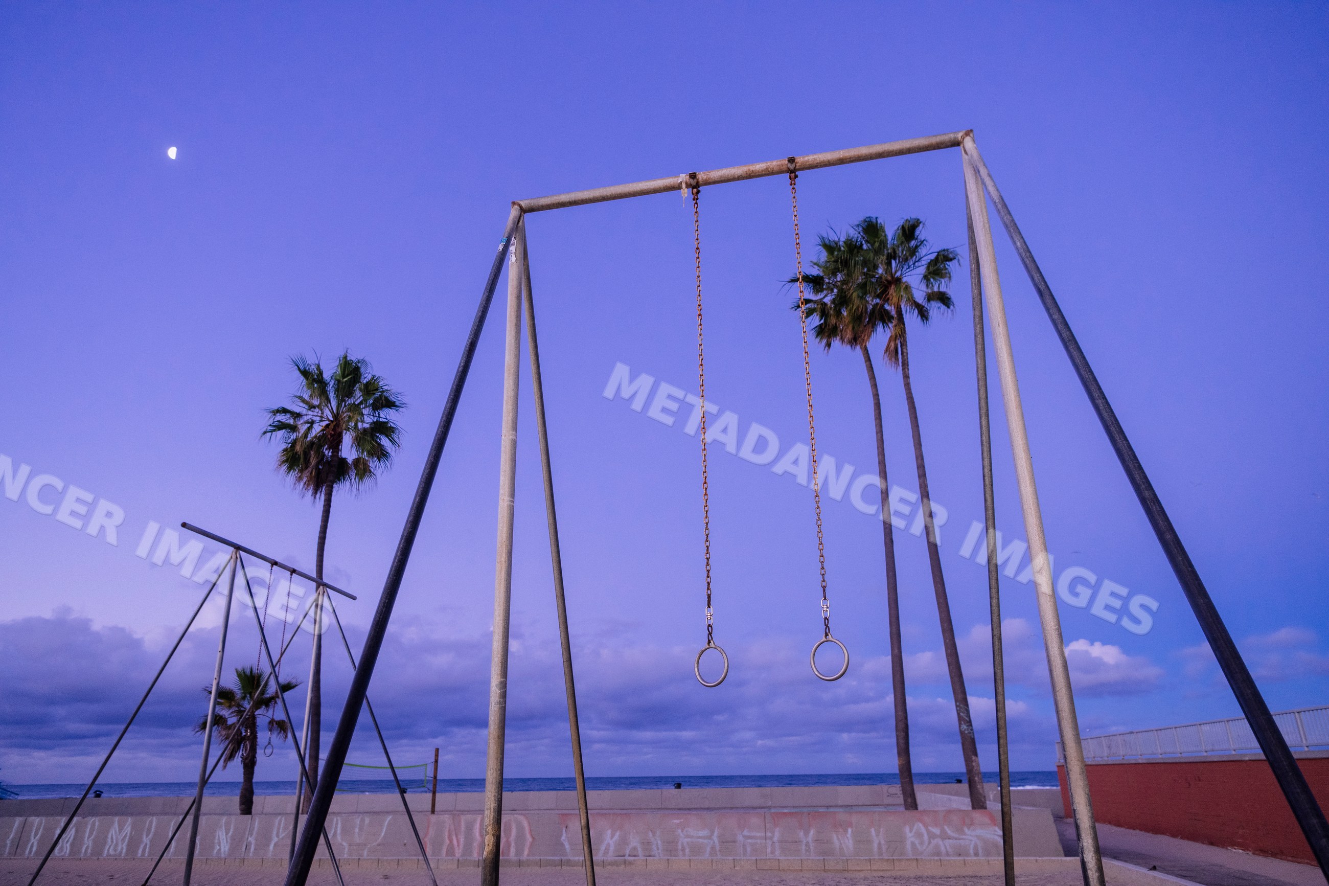 Gymnastic rings outdoor exercise area at Venice Beach at twilight