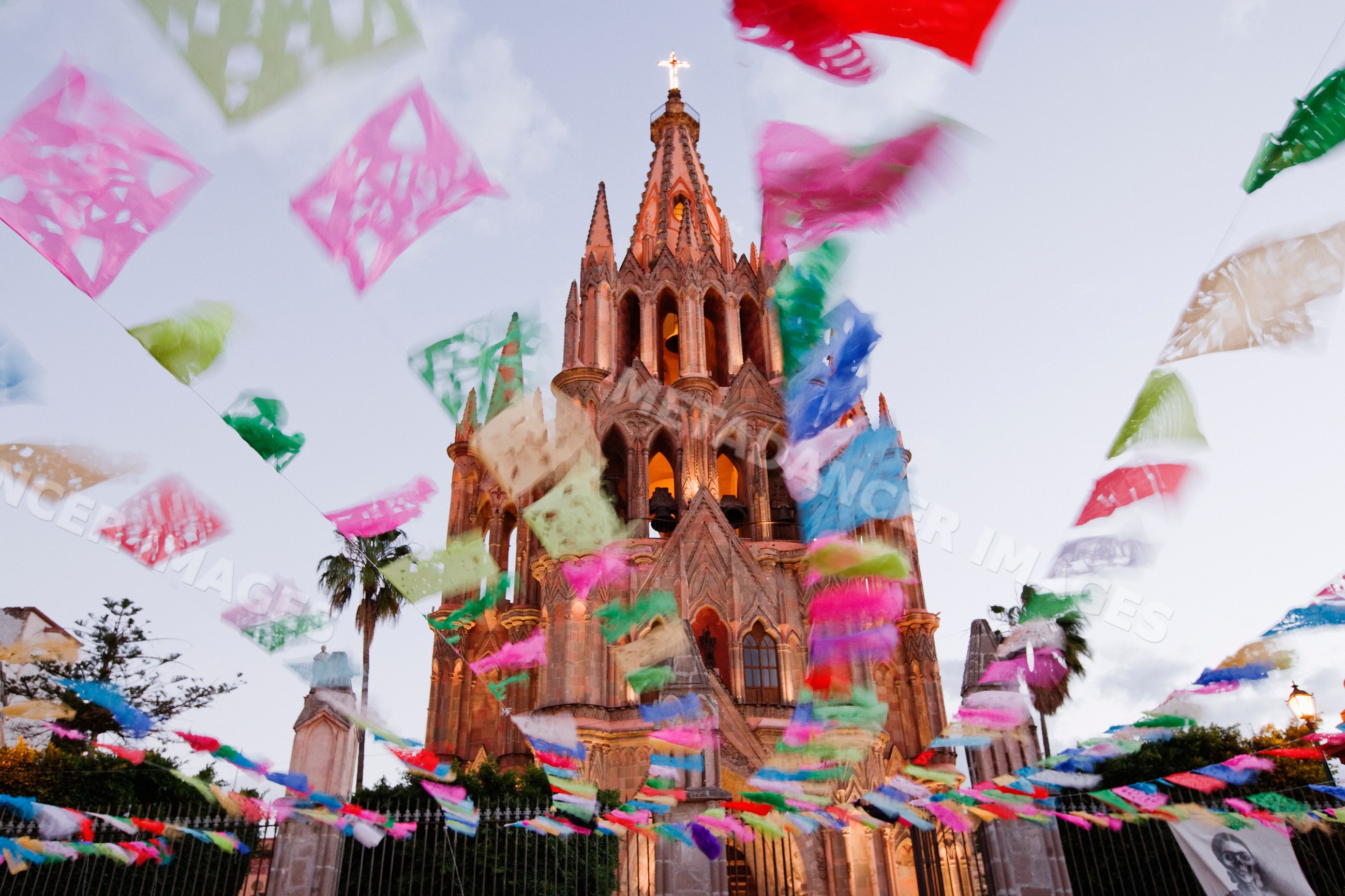 Church decorated with paper banners during day of the dead
