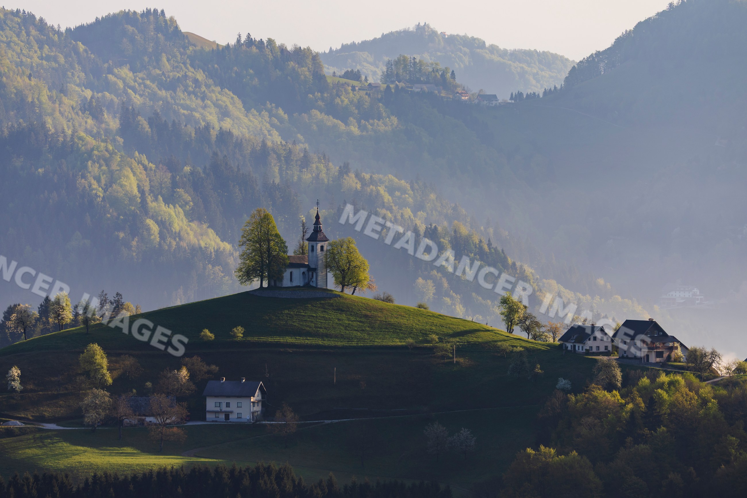 St thomas's church on hilltop at Sunrise in škofja loka, Slovenia