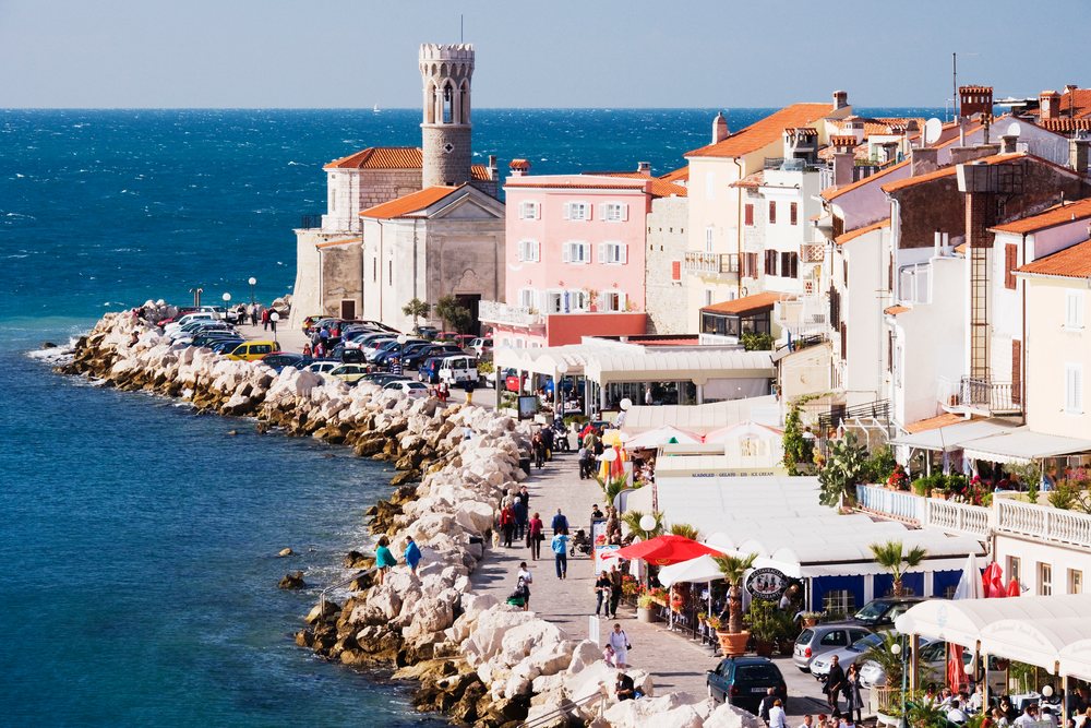 Town of piran promenade along the mediterranean sea with historic