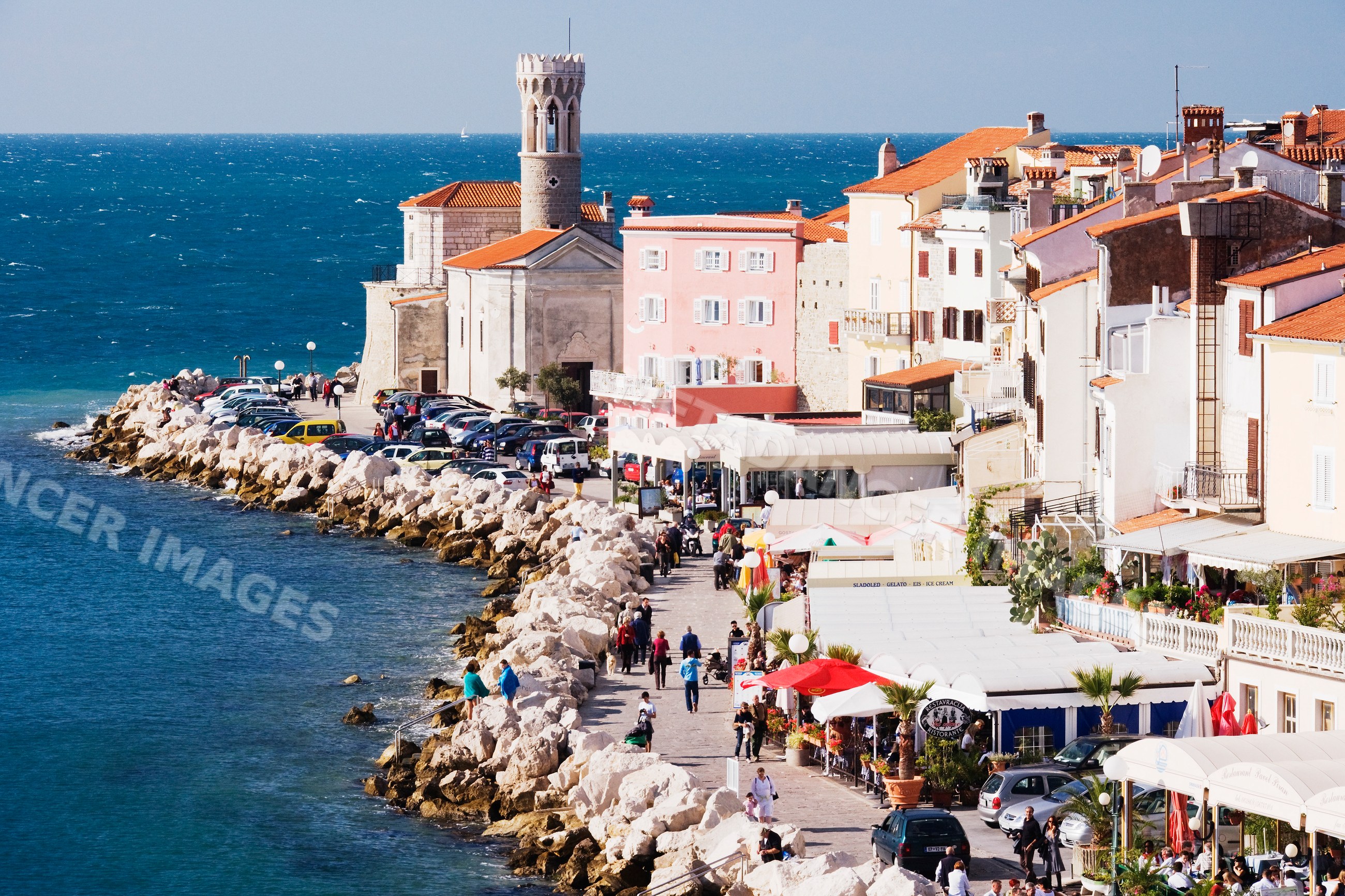Town of piran promenade along the mediterranean sea with historic