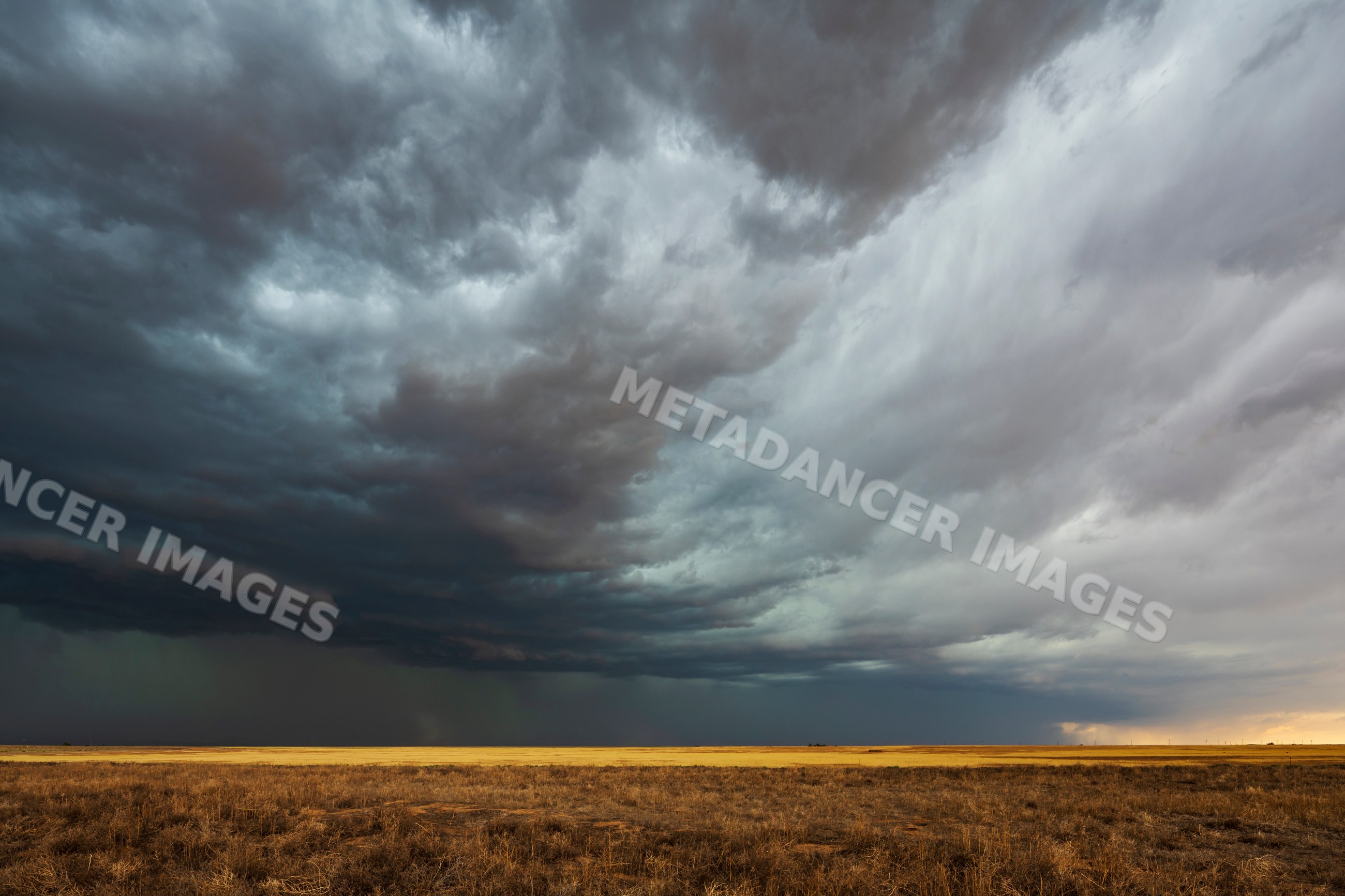 Storm Cell with dark clouds over dry field in dumas texas