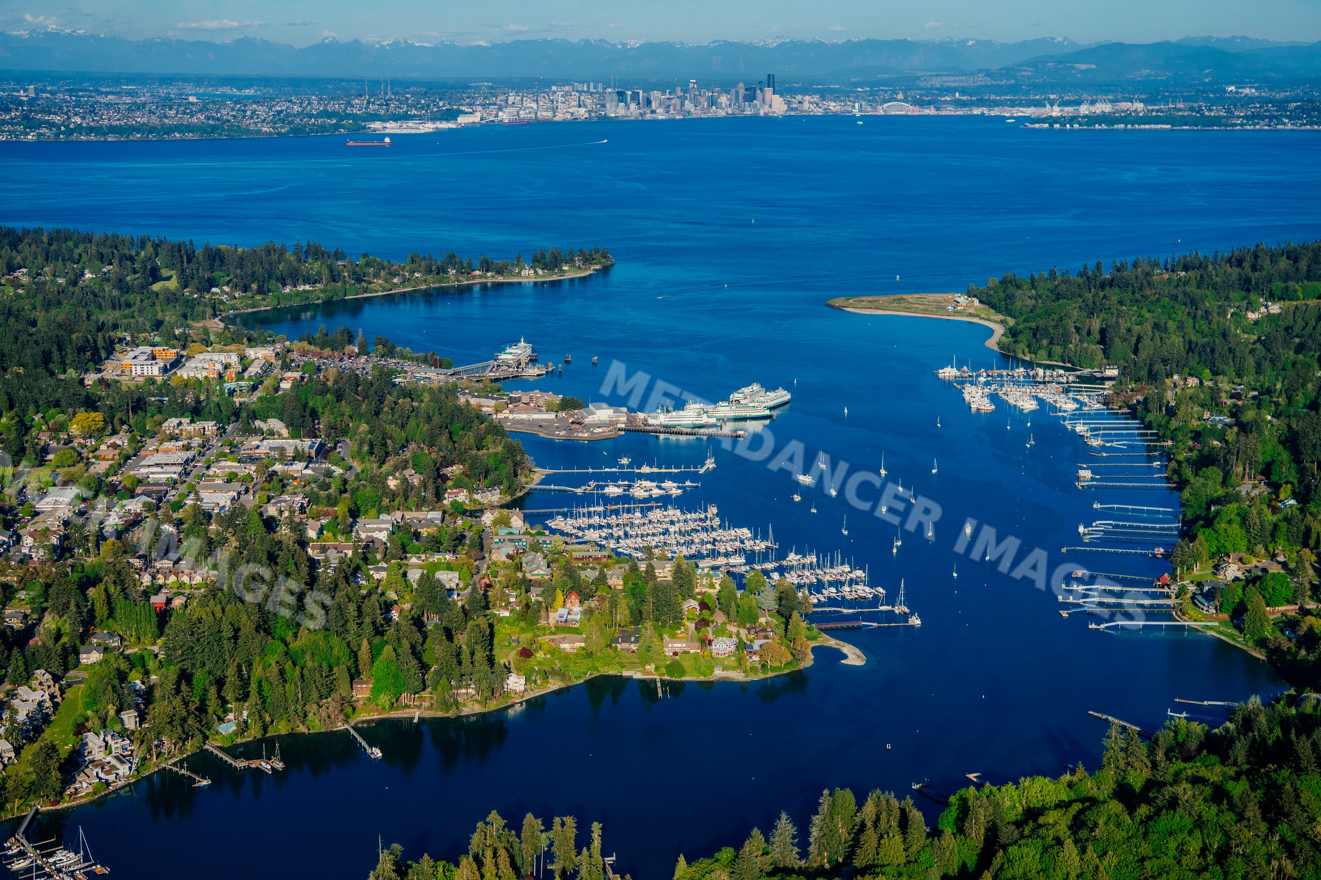 Aerial view of Bainbridge Island harbor with seattle skyline