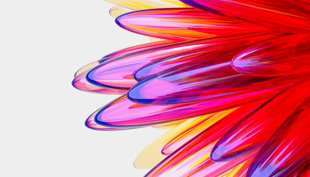 Colorful abstract glass sculpture with vibrant red and purple petals