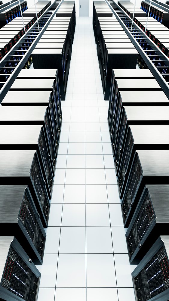 Data center aisle with rows of server racks in a modern facility