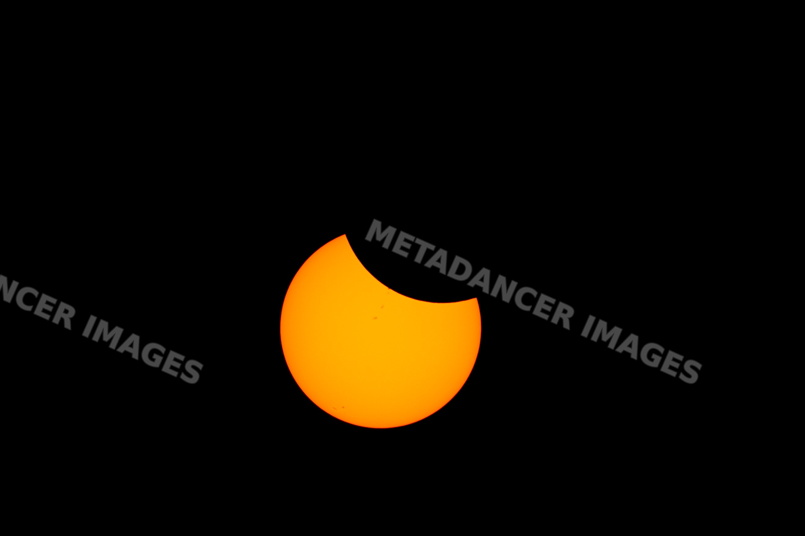 Partial solar eclipse over the sun