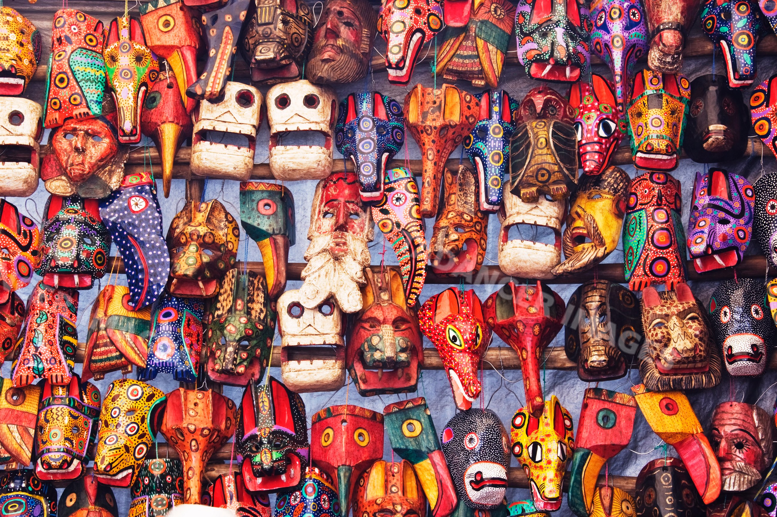 Colorful wooden masks displayed