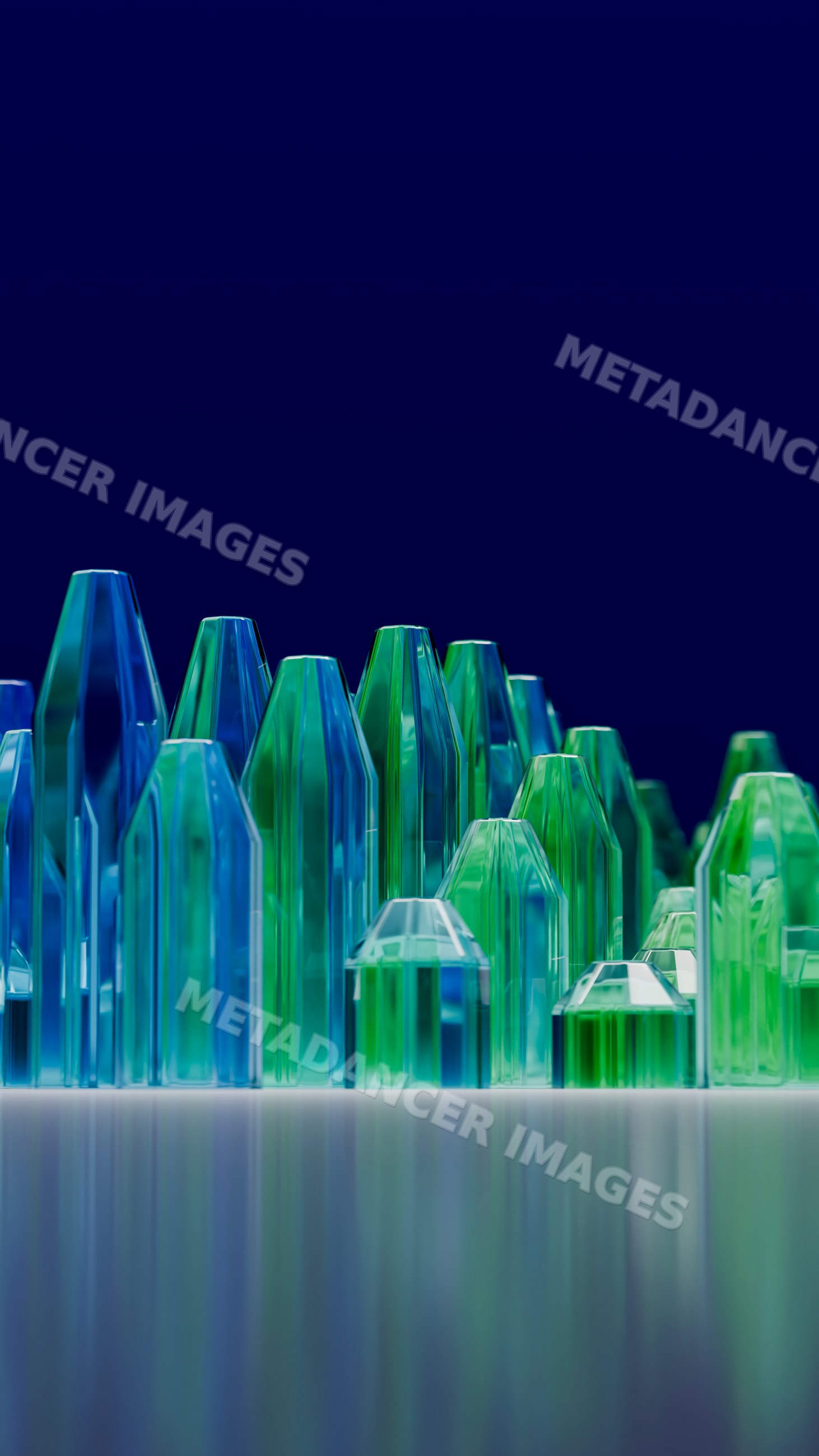 Cluster of colorful blue and green glass crystals on reflective