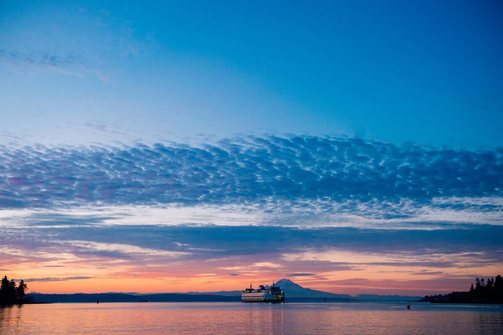 Ferry crossing water near mount rainier at sunset on Bainbridge Island
