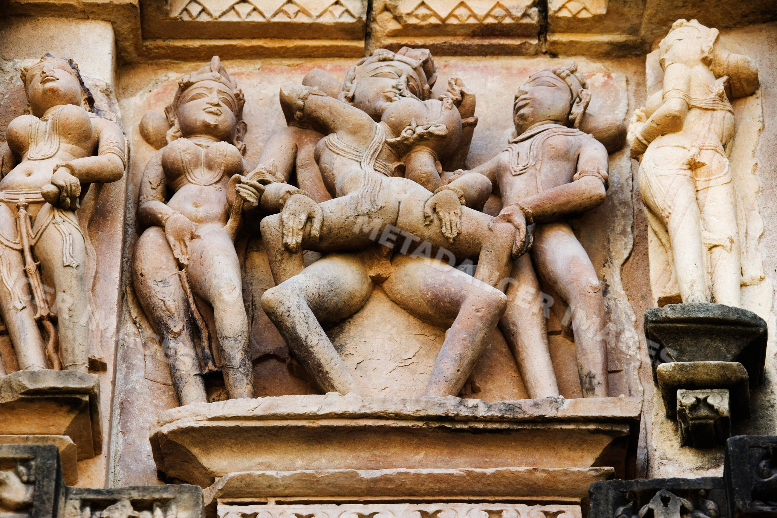 Erotic stone sculptures at khajuraho temple india