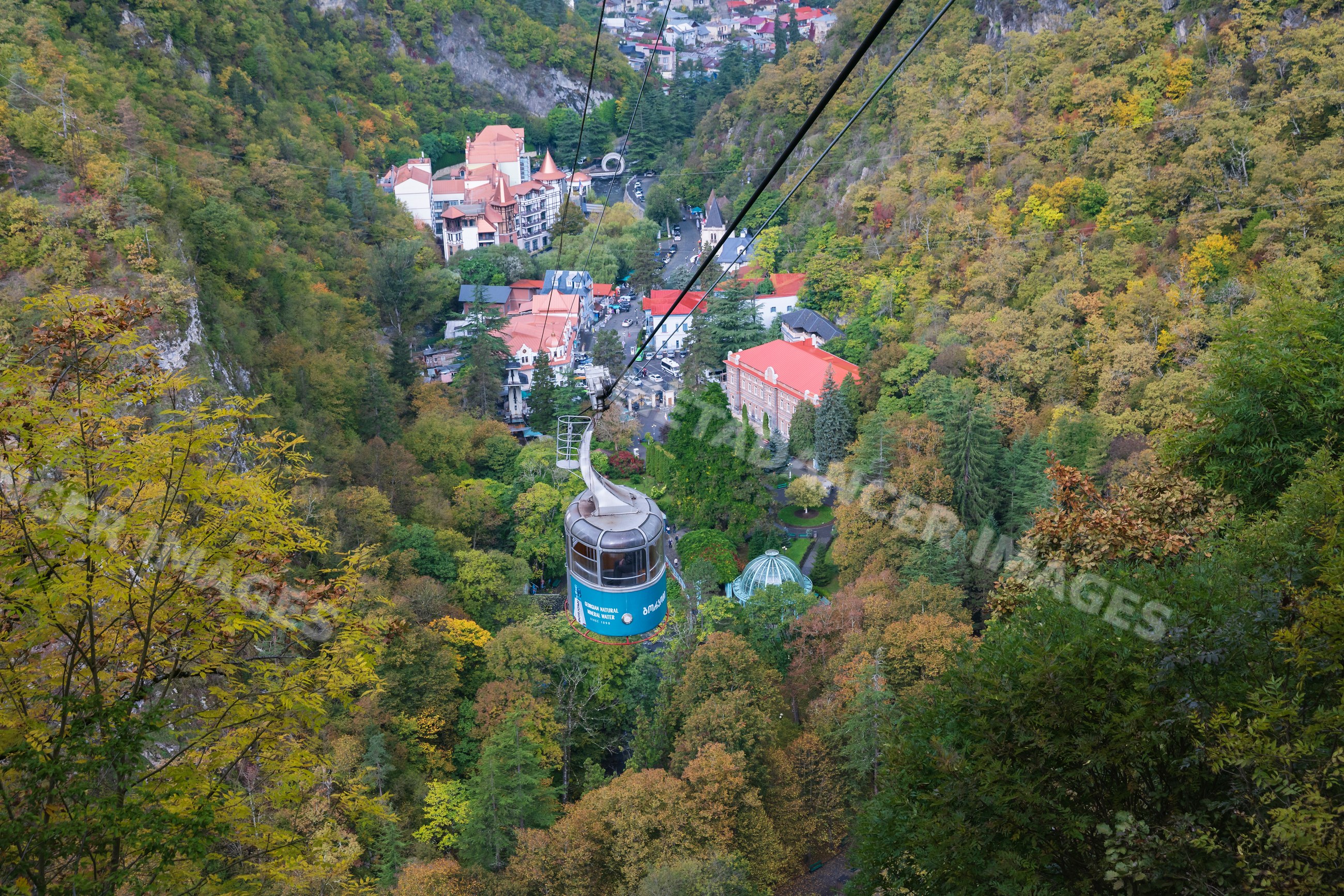 Borjomi Cable Car traveling over autumn forest valley