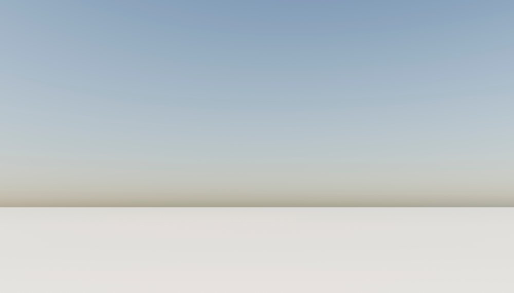 Empty flat landscape with clear gradient sky and horizon line