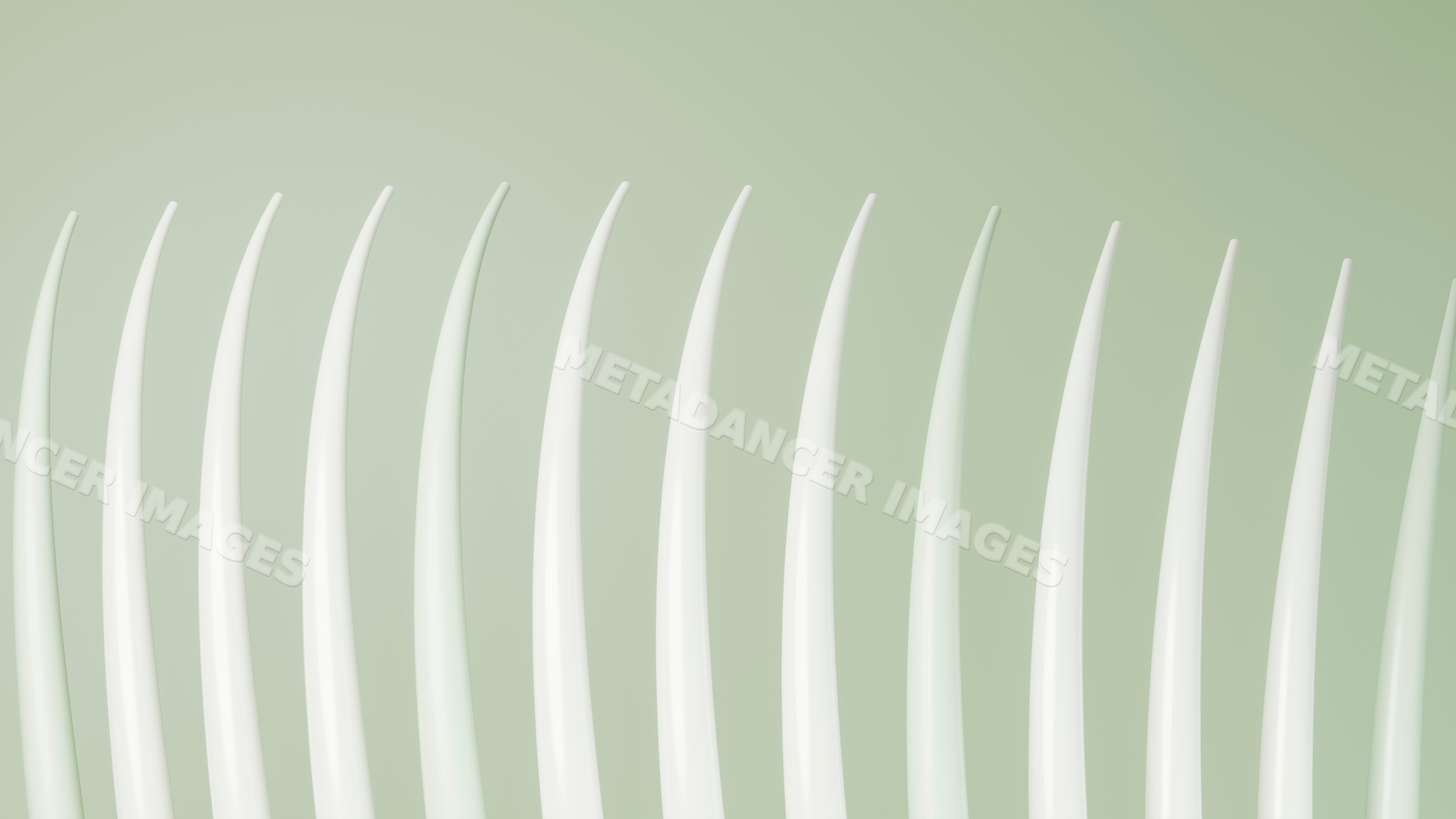 Row of white plastic forks lined up on green background