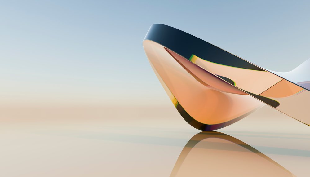 Closeup of a modern abstract reflective sculpture with smooth curves