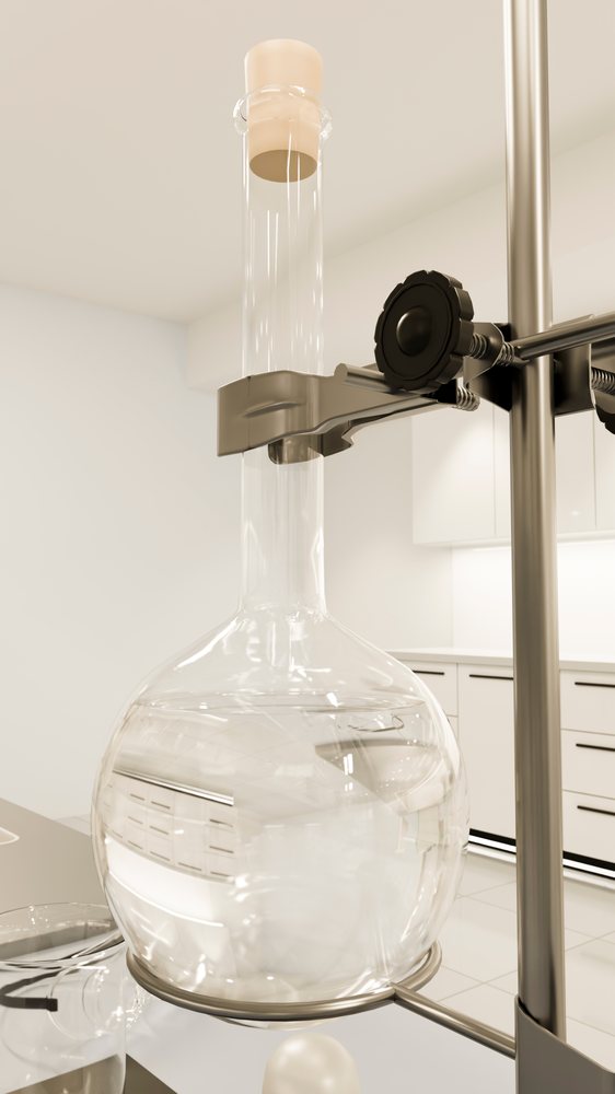 Round-bottom flask held in clamp stand filled with clear liquid