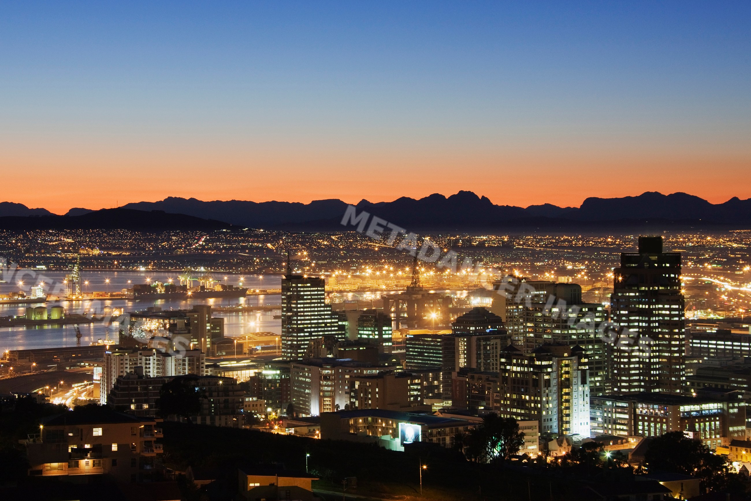 Cityscape of cape town with illuminated buildings and mountain