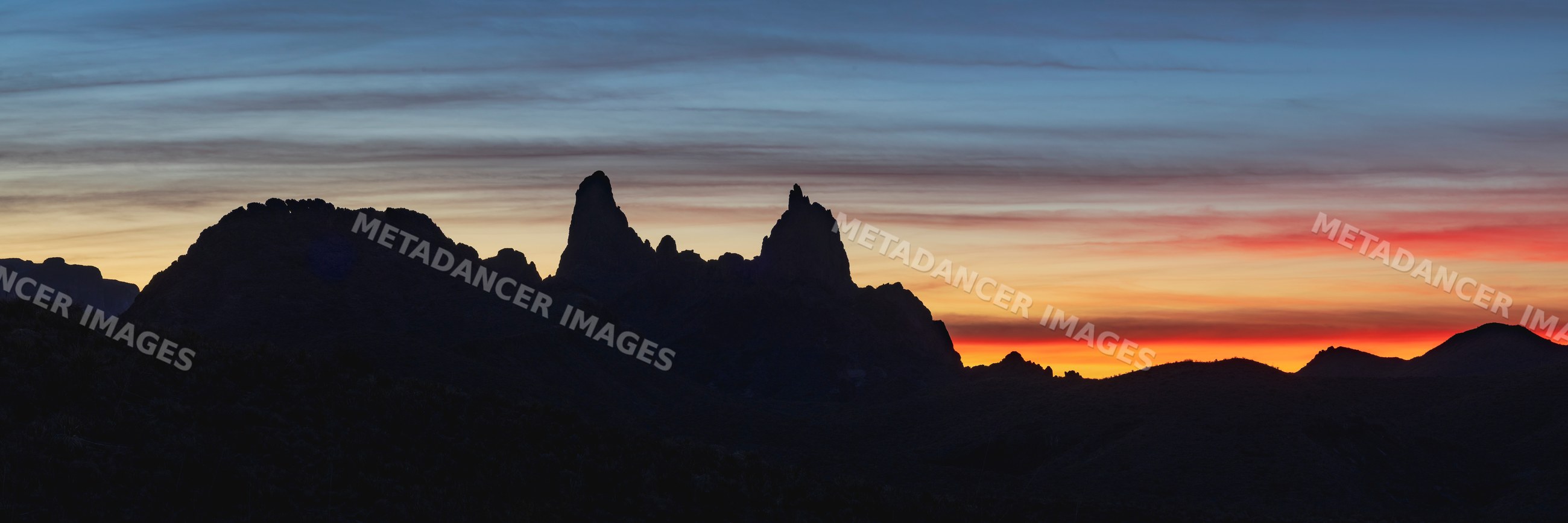 Silhouette of Mule Ears rock formation