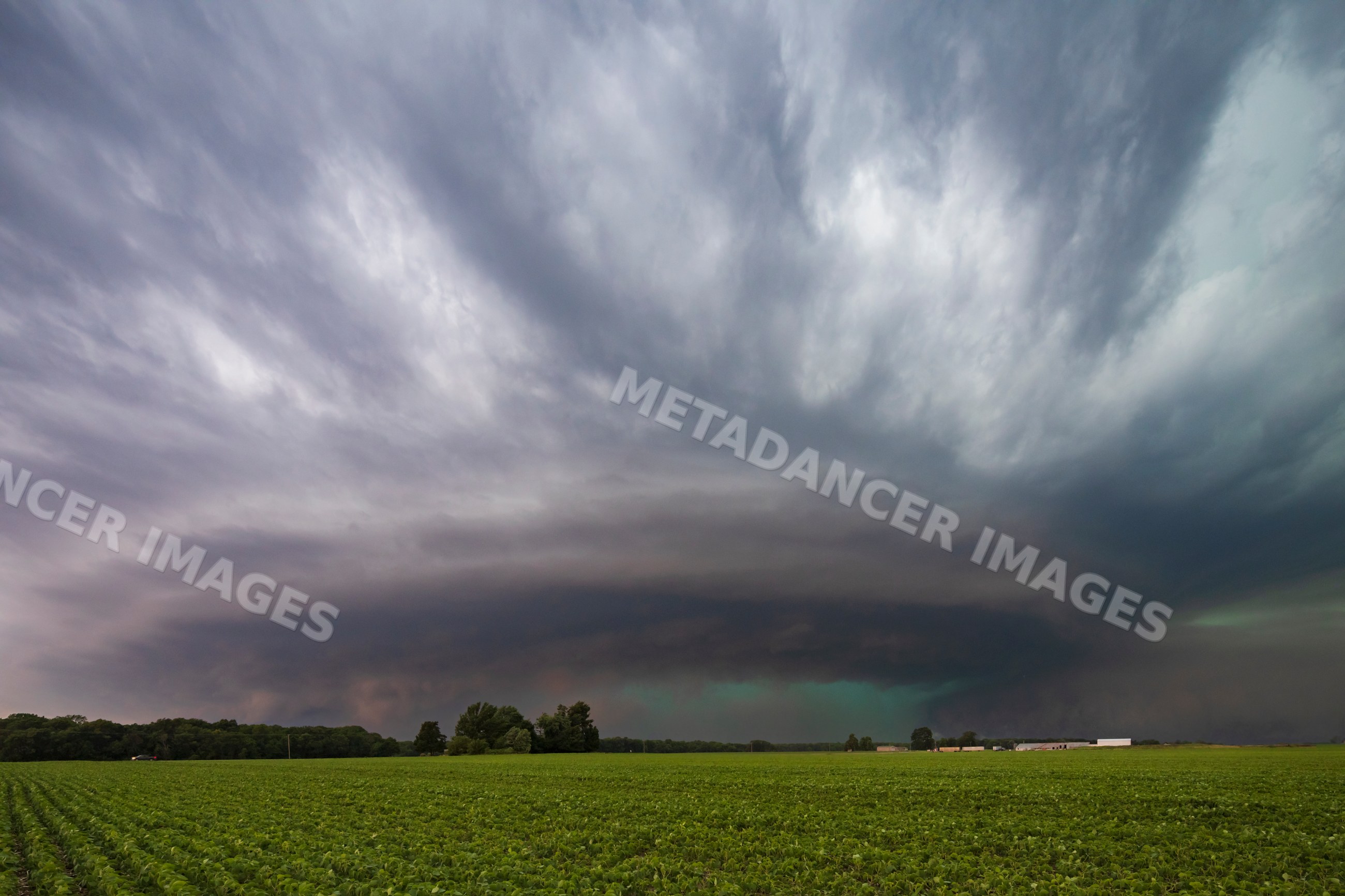 Cyclic Supercell storm cloud over green field near charleston
