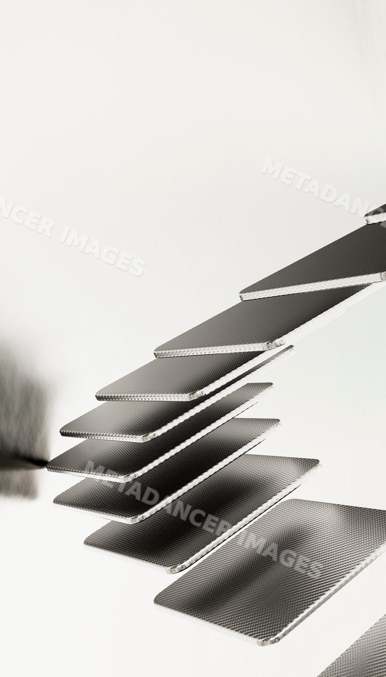 Metallic floating stair steps in a minimalist modern interior
