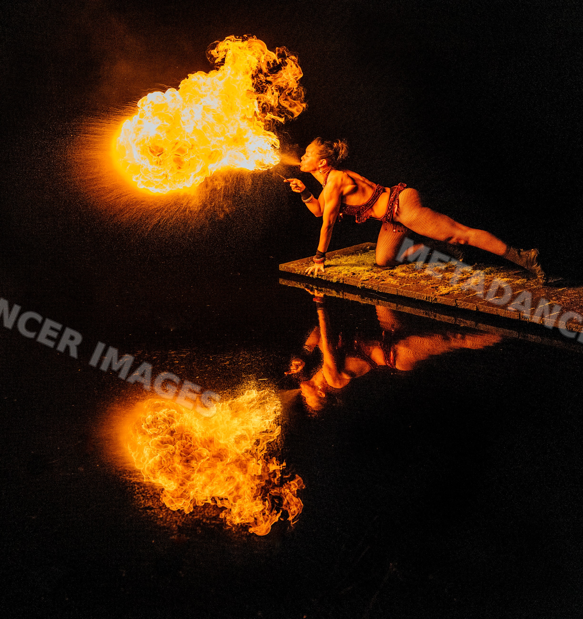 Female fire breather performing