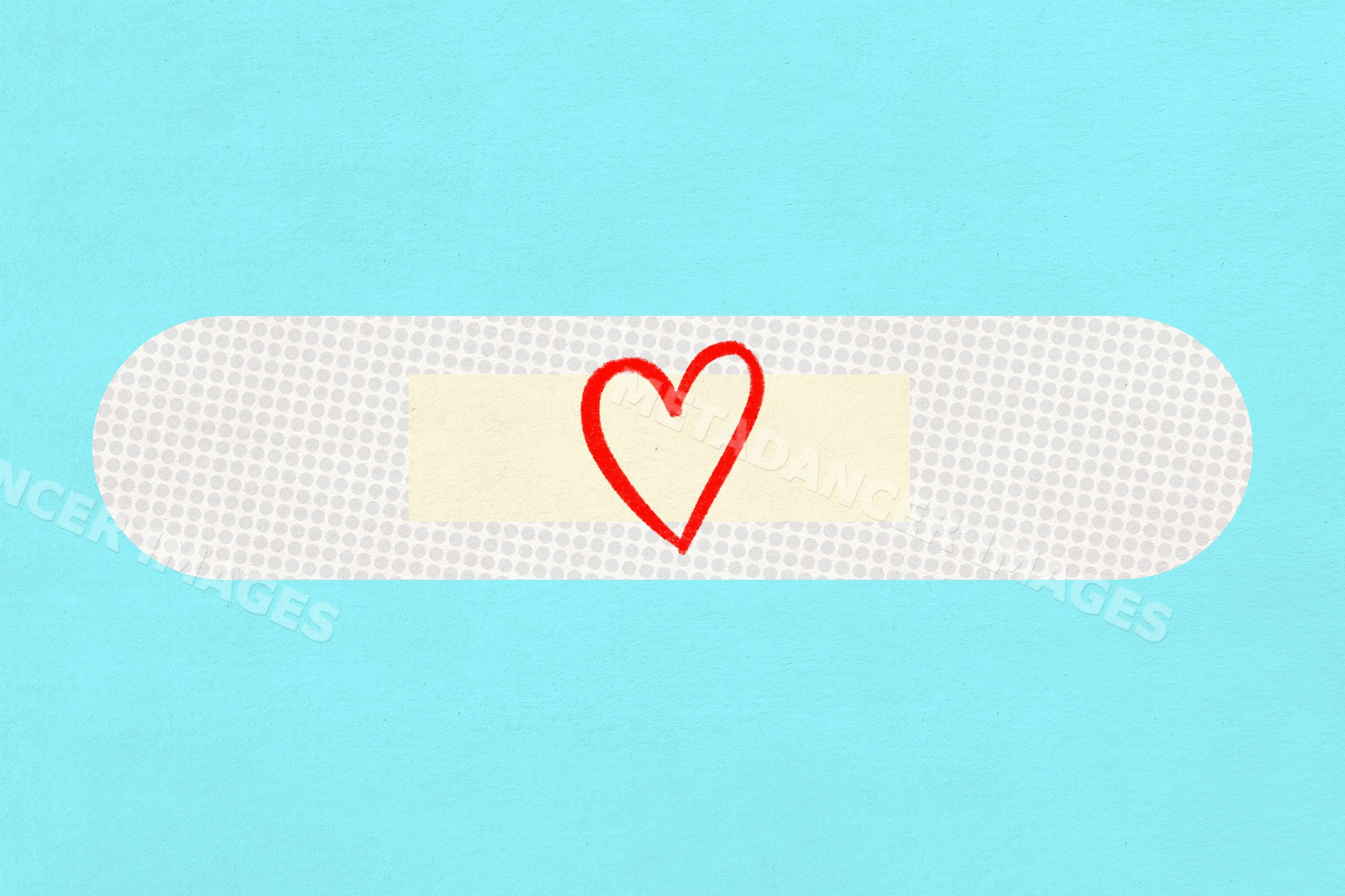 A white adhesive bandage with a red heart drawing on blue background