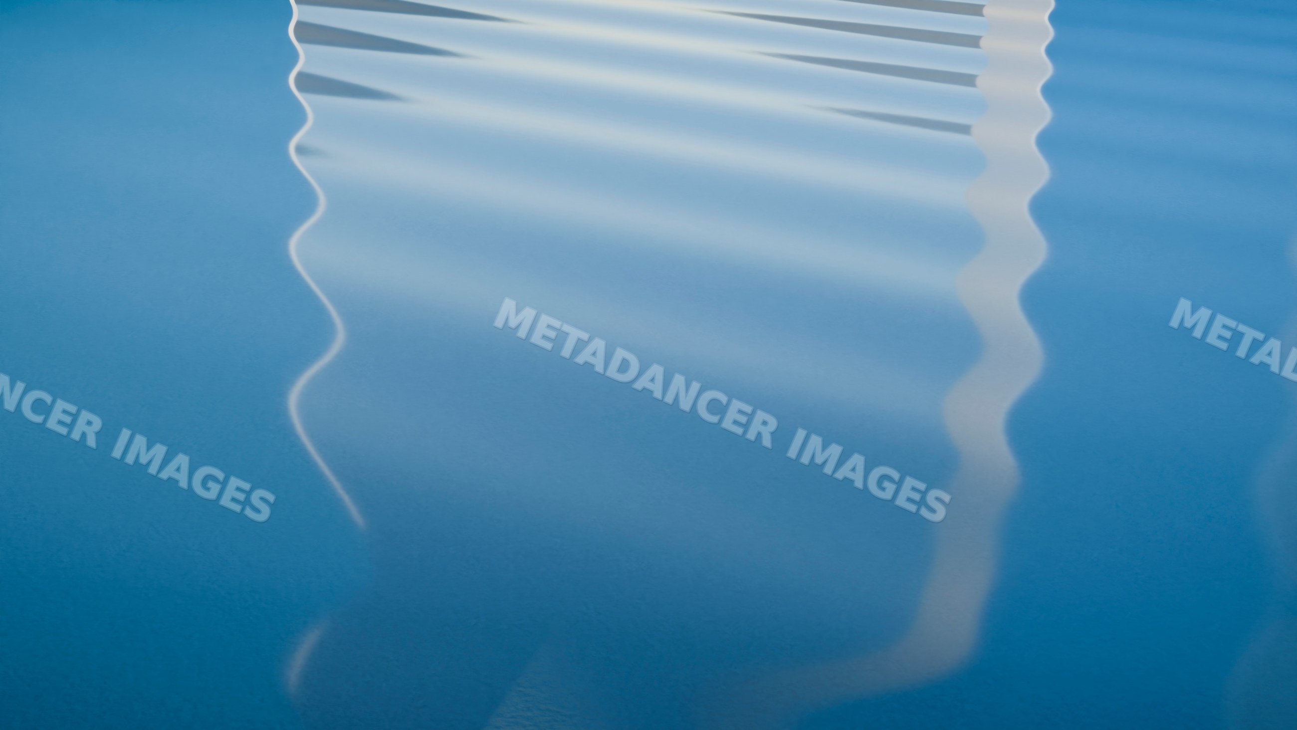 Water surface with gentle ripples reflecting light