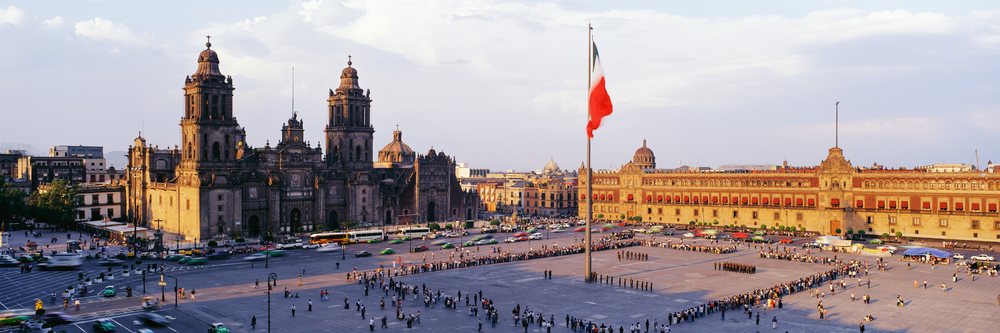 Zocalo plaza with mexican flag and historic cathedral