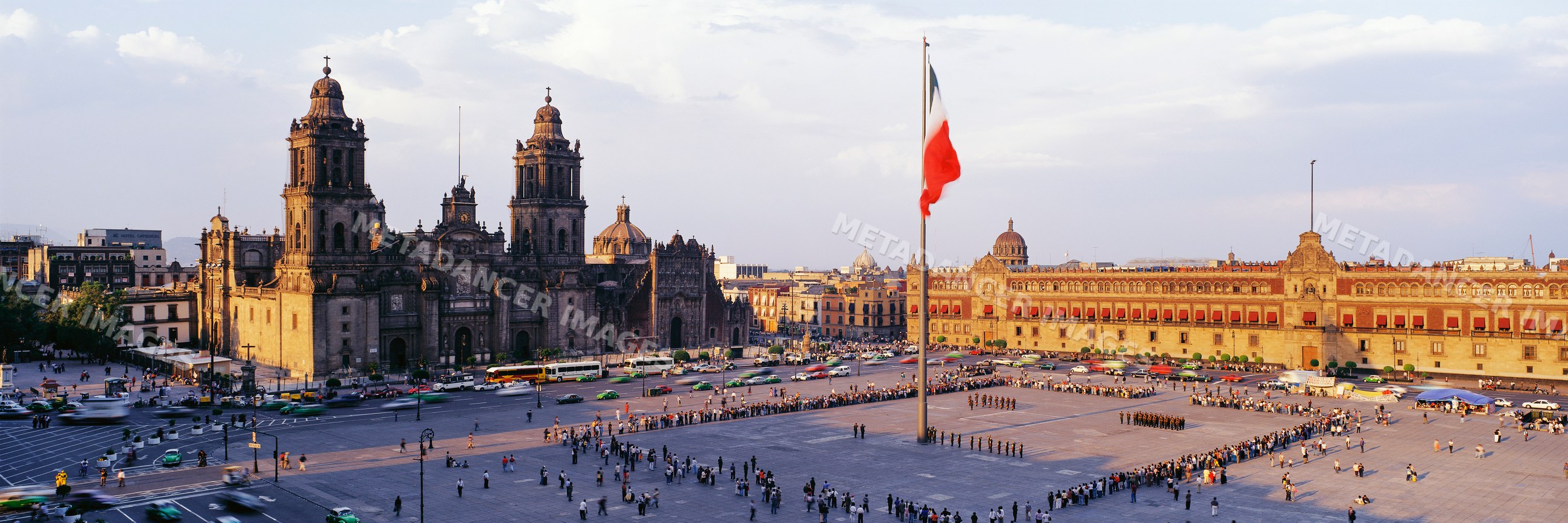 Zocalo plaza with mexican flag and historic cathedral