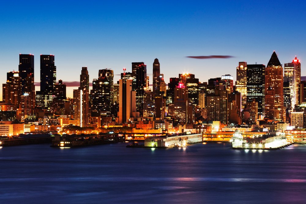 Skyline of midtown manhattan illuminated at dusk city