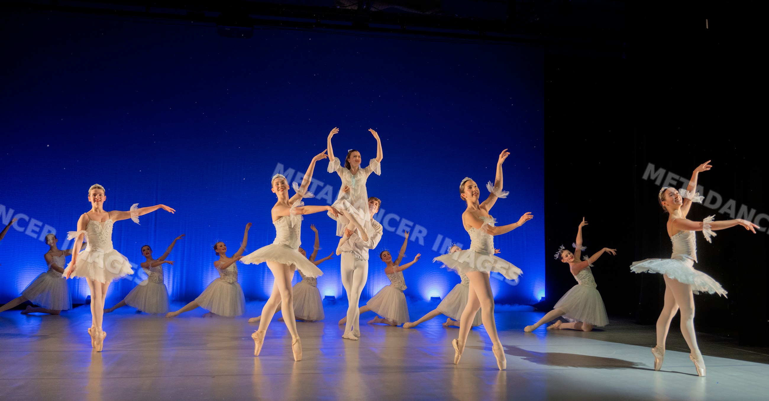 Ballet dancers perform a lifted scene from a traditional holiday