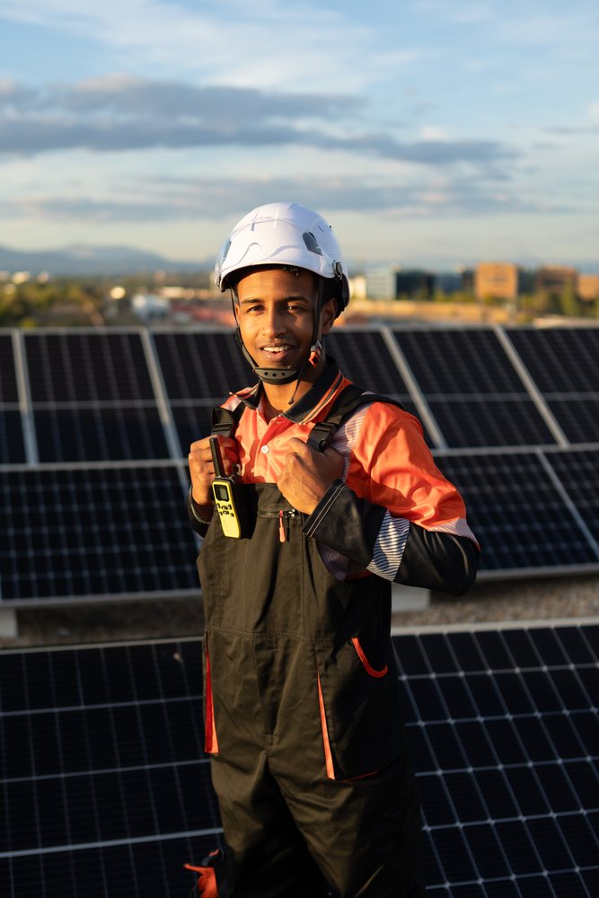 Solar energy technician with safety gear on site