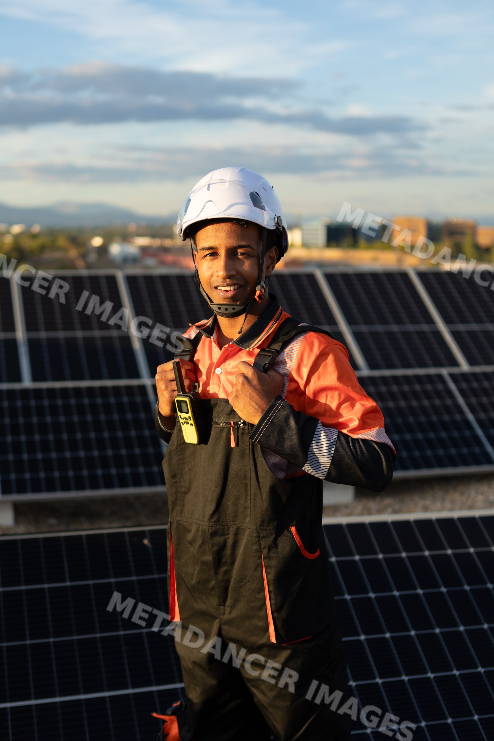 Solar energy technician with safety gear on site
