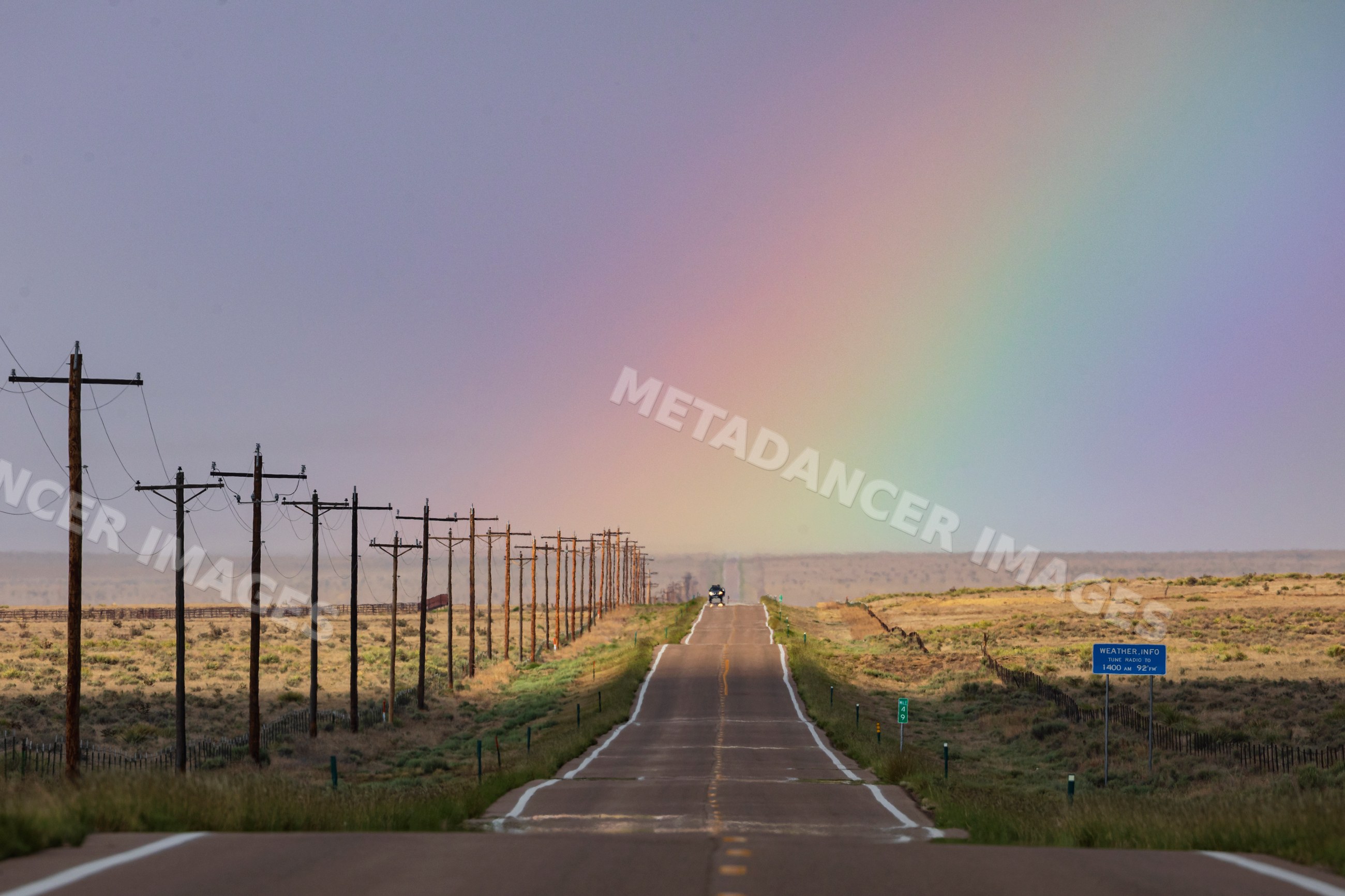 Highway 10 with rainbow near rocky ford colorado USA