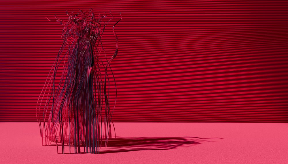 Abstract metal wire sculpture on pink surface with red background