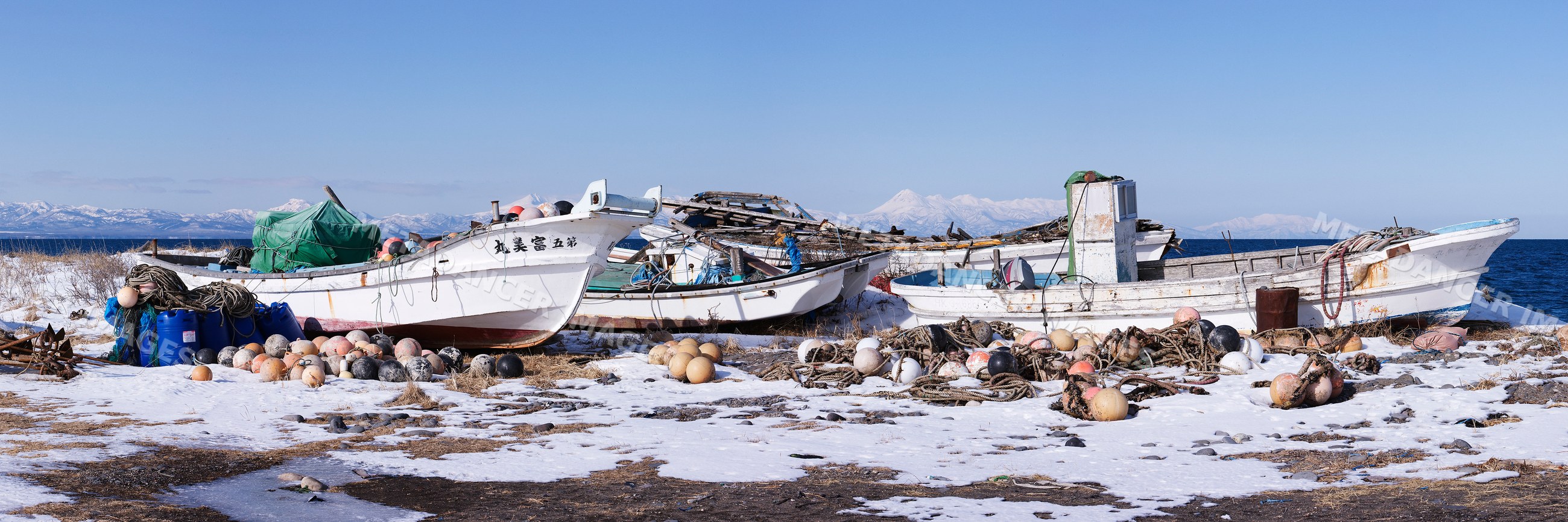Fishing boats on snowy coast, hokkaido