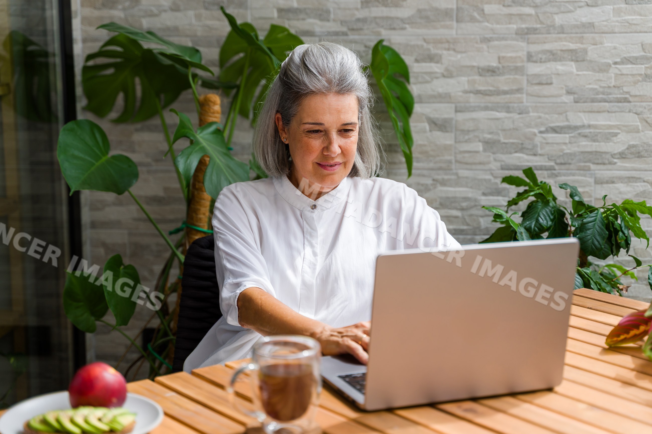 White Woman working on laptop
