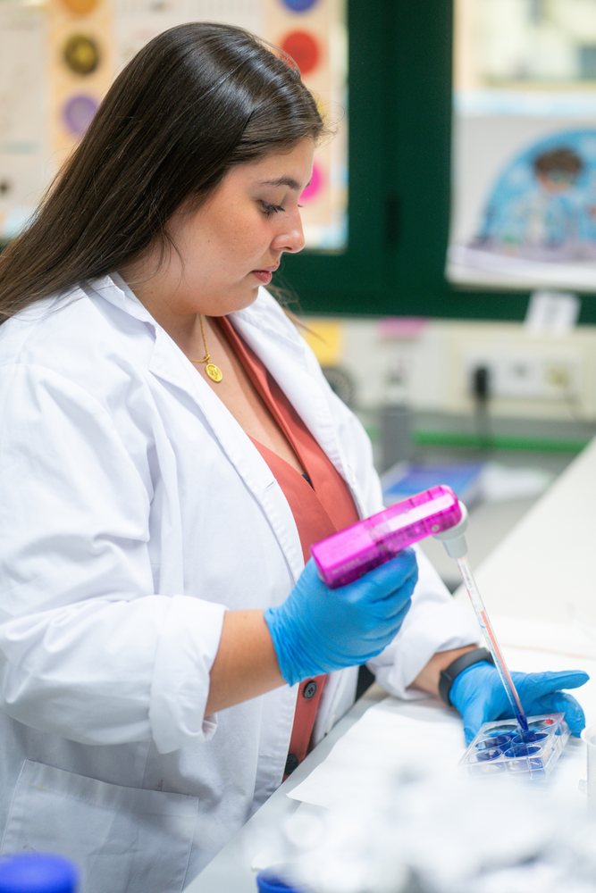 Scientist using pipette for laboratory research in Seville, Andalucía