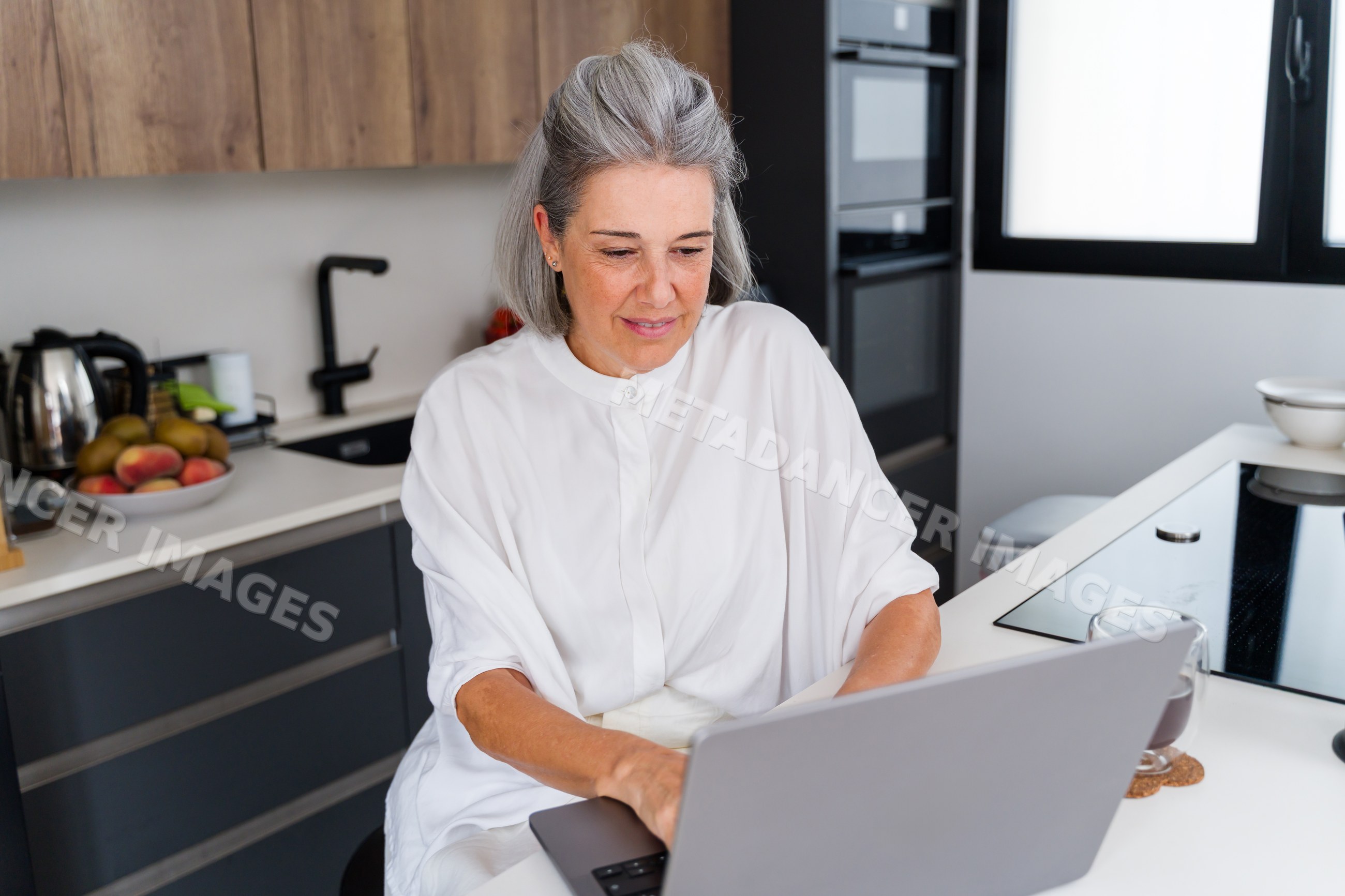 White Woman working on laptop