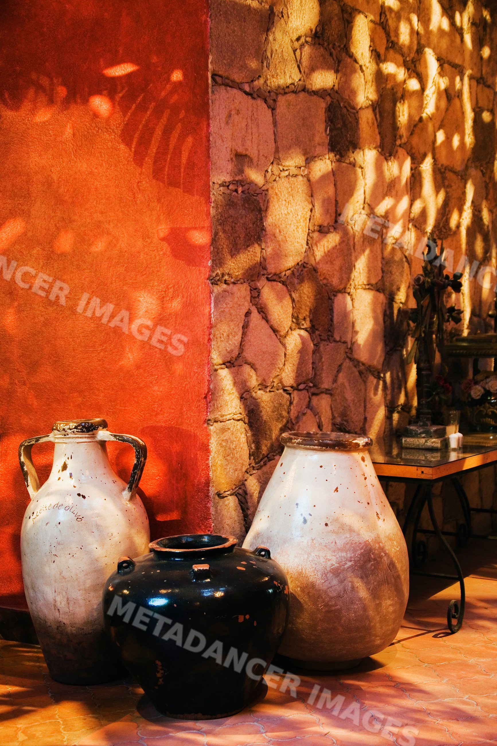 Clay pots against stone and stucco wall