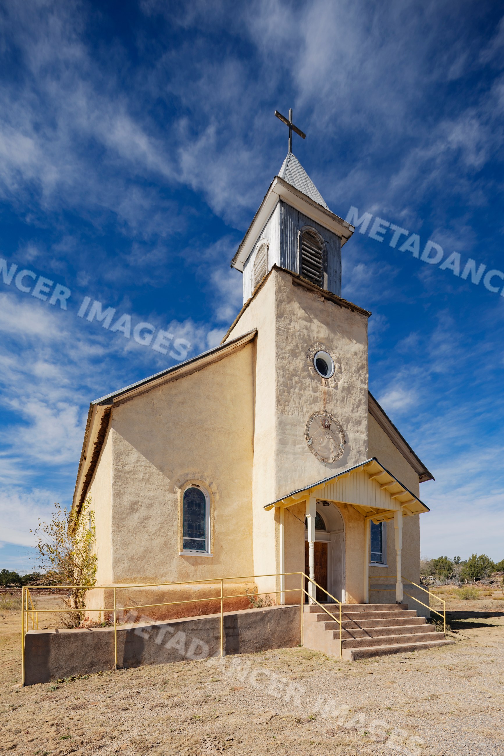 Sacred Heart Church building with bell tower in dilia new mexico