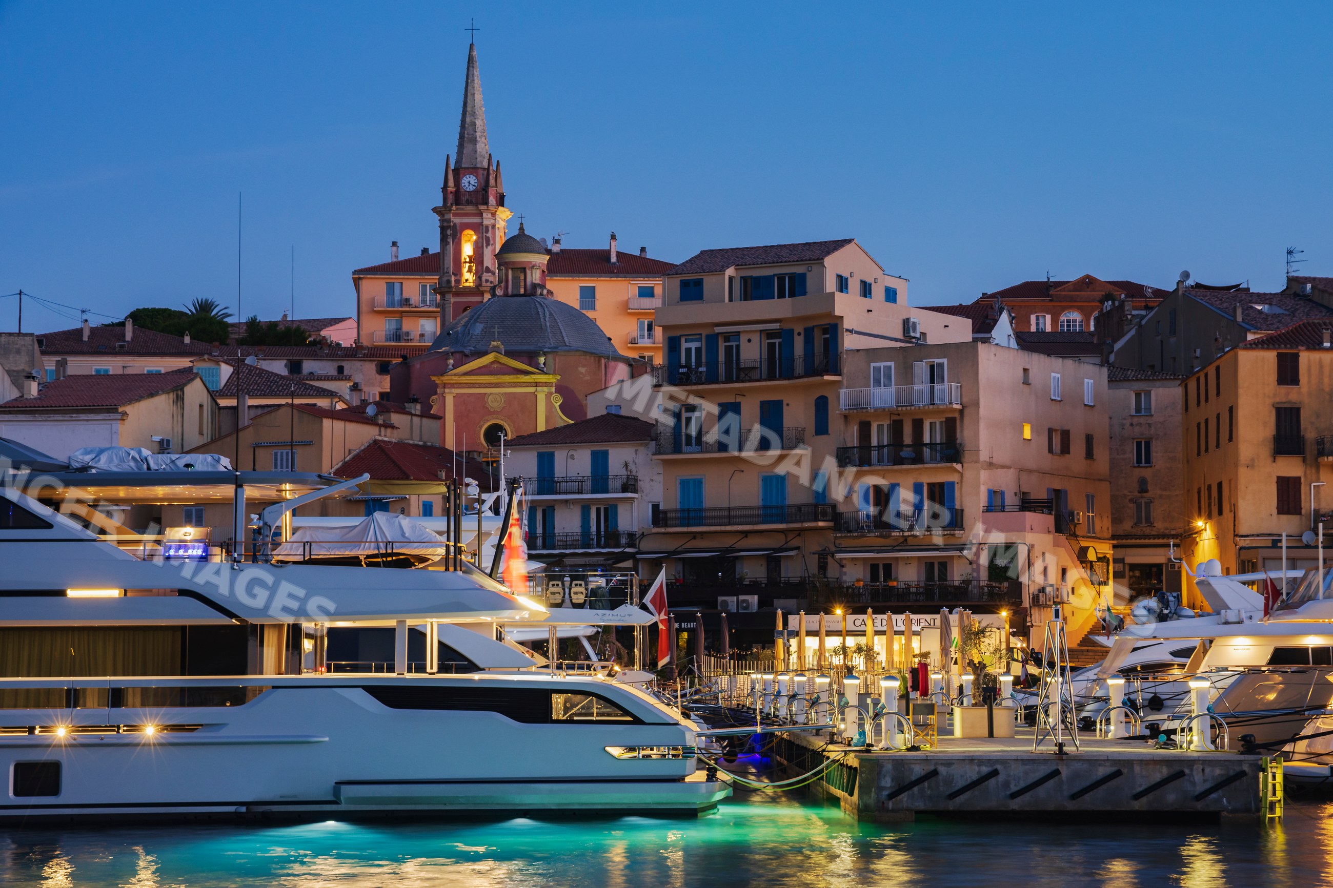 Harbour at Calvi at Dawn with yachts and historic buildings