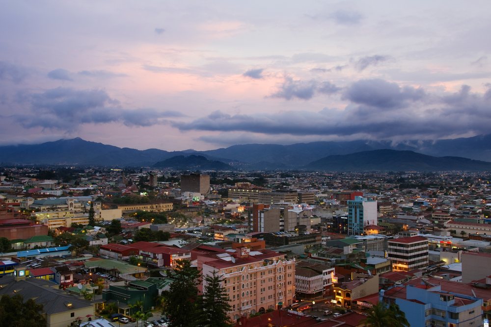 Cityscape of san jose, costa rica at sunset with mountain backdrop