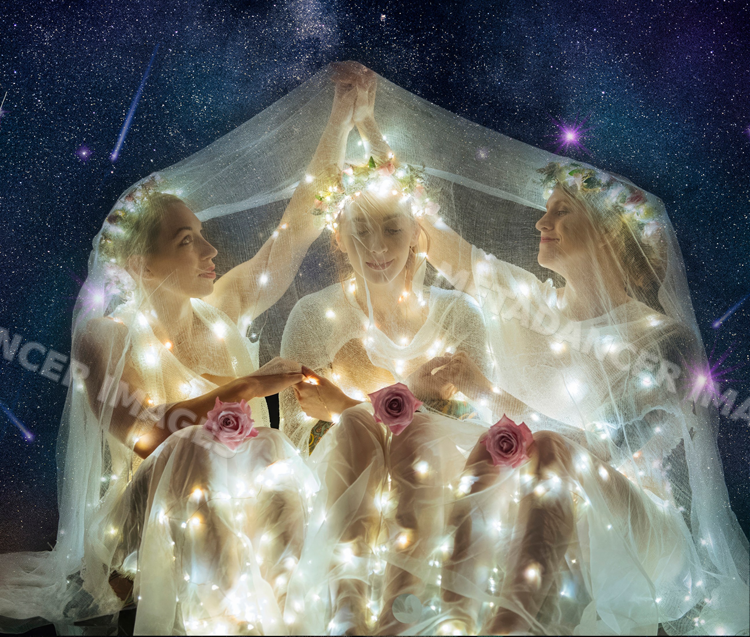 Three white women with flower crowns and fairy lights under starry