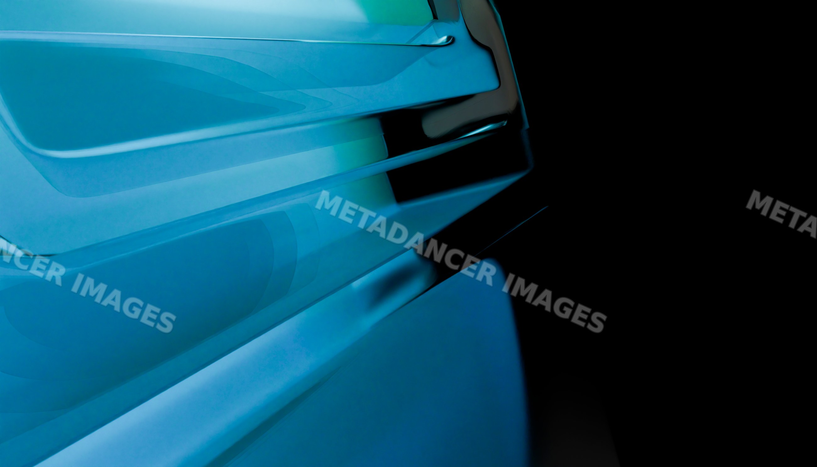 Close-up of blue abstract glass shapes with smooth reflections