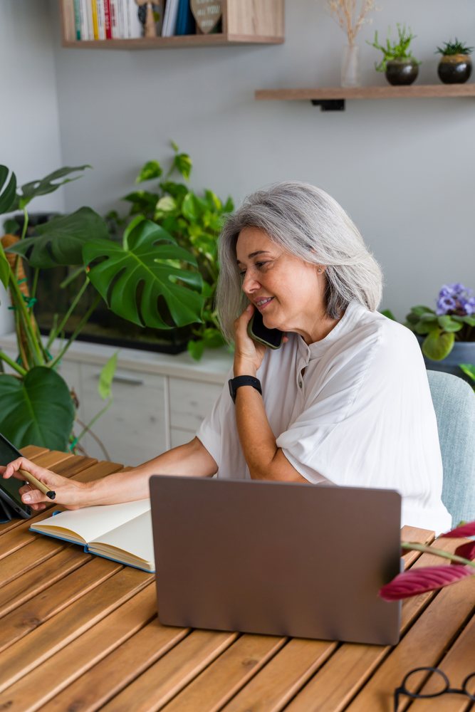 White Woman with gray hair working