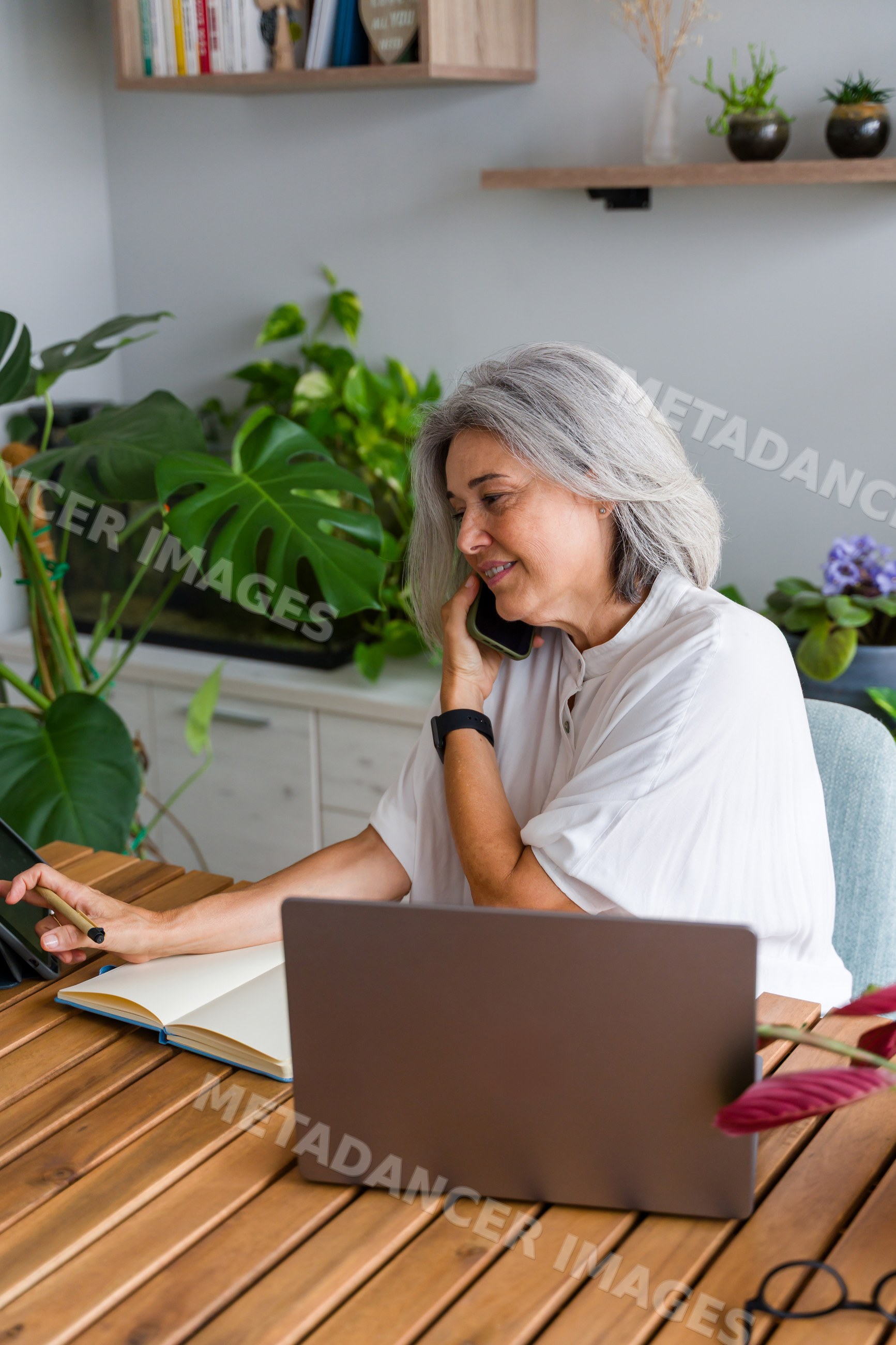 White Woman with gray hair working
